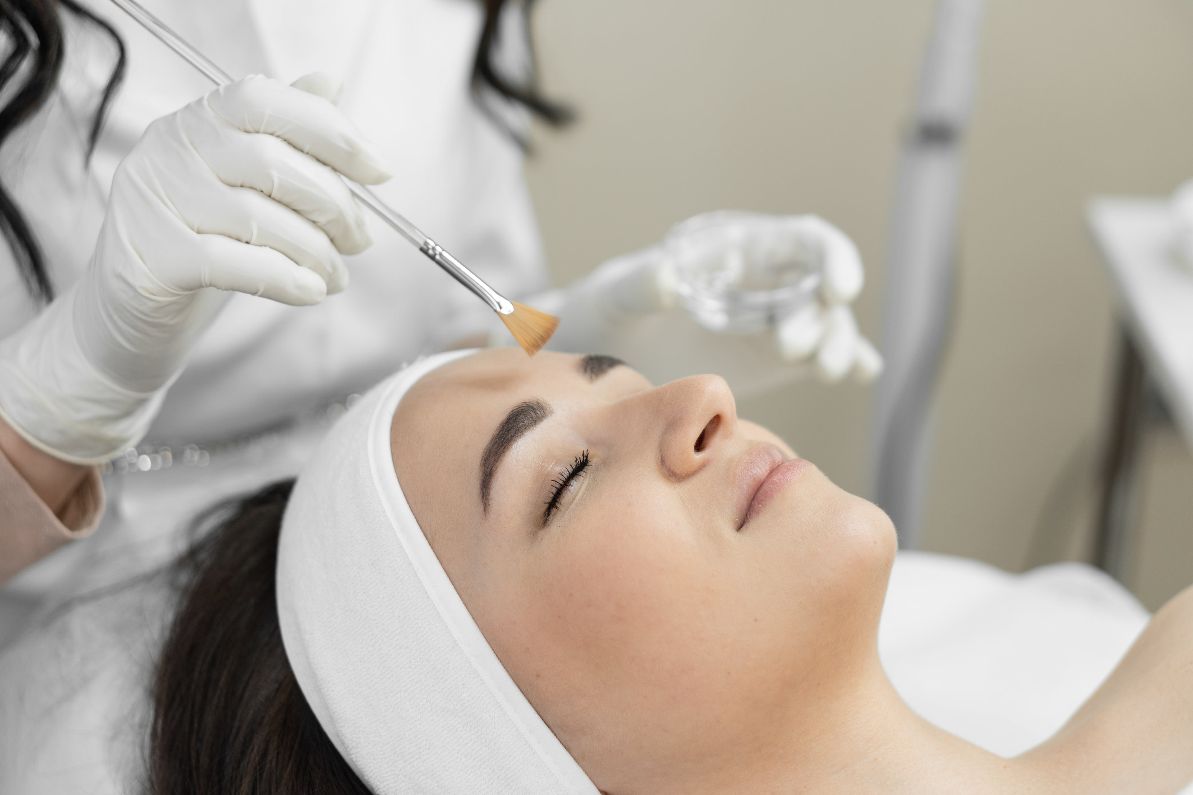 women receiving a facial